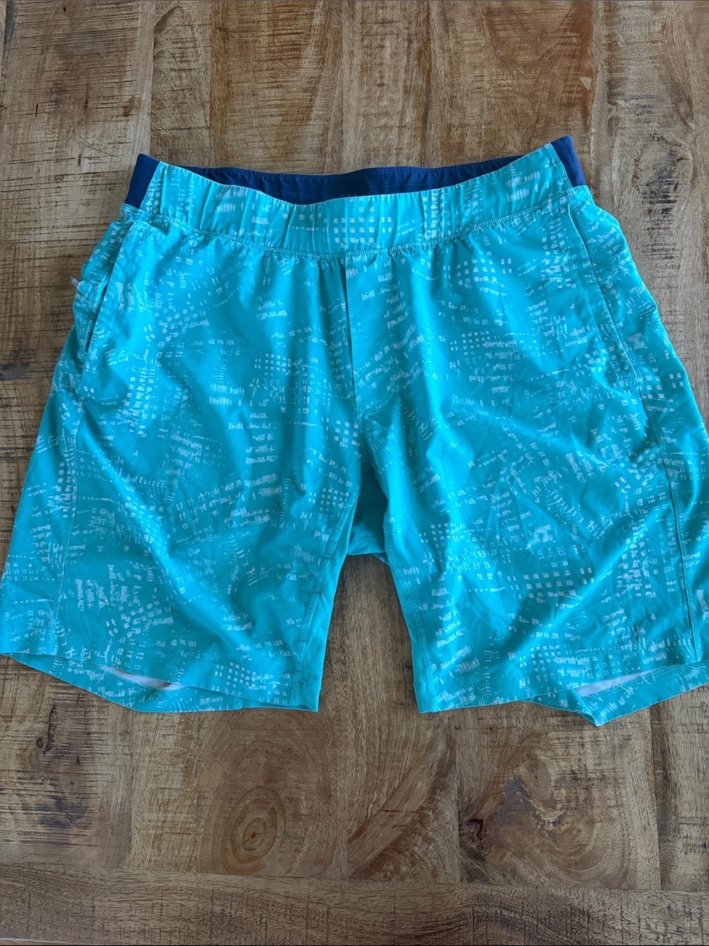 lululemon athletica turquoise patterned athletic shorts with navy waist